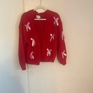 Elegant Red Cardigan with Pink Ribbon Details